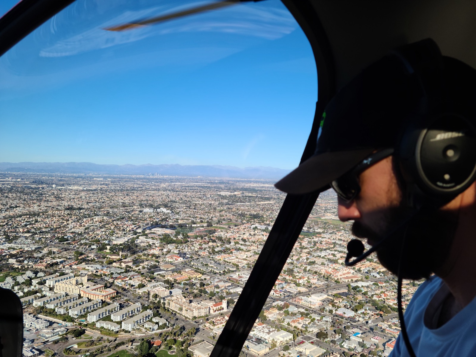 Matthew Smith flying with a city view from the cockpit